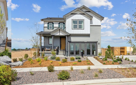 A backyard with a table and chairs.