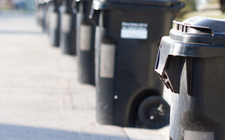 A parking meter on the side of a street.