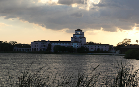A body of water with buildings in the background.