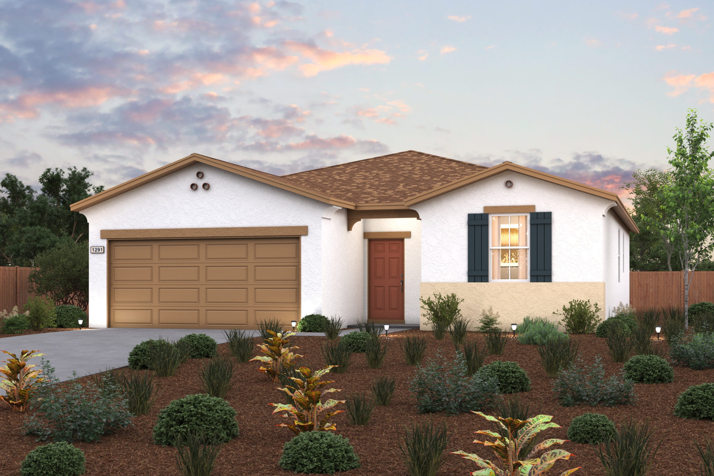 A house with a garage and bushes in front of it.