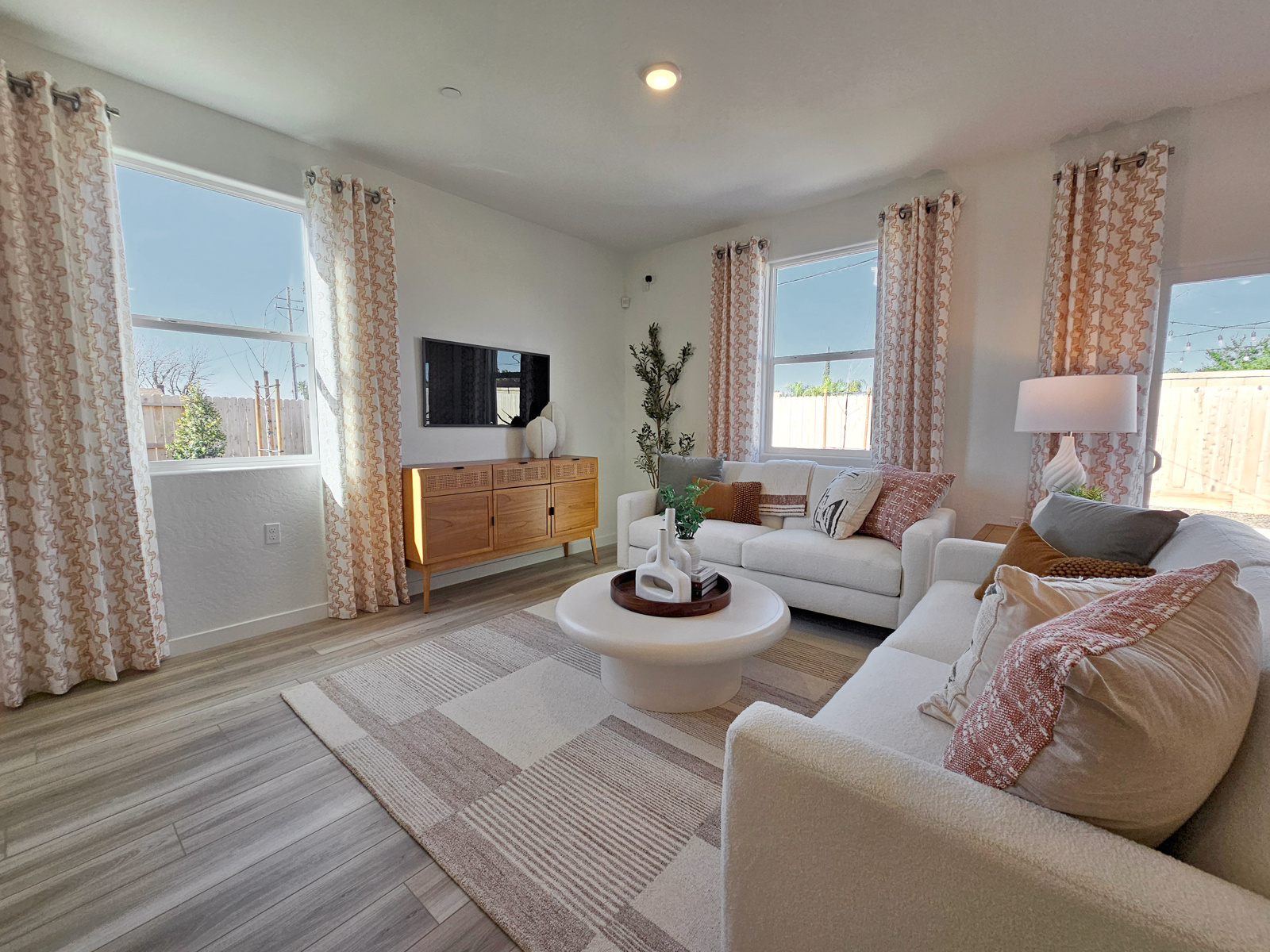 A living room with a large window.