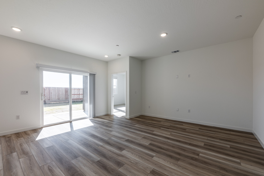 A room with a wood floor and a wood floor.