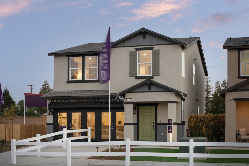 A house with a white picket fence.