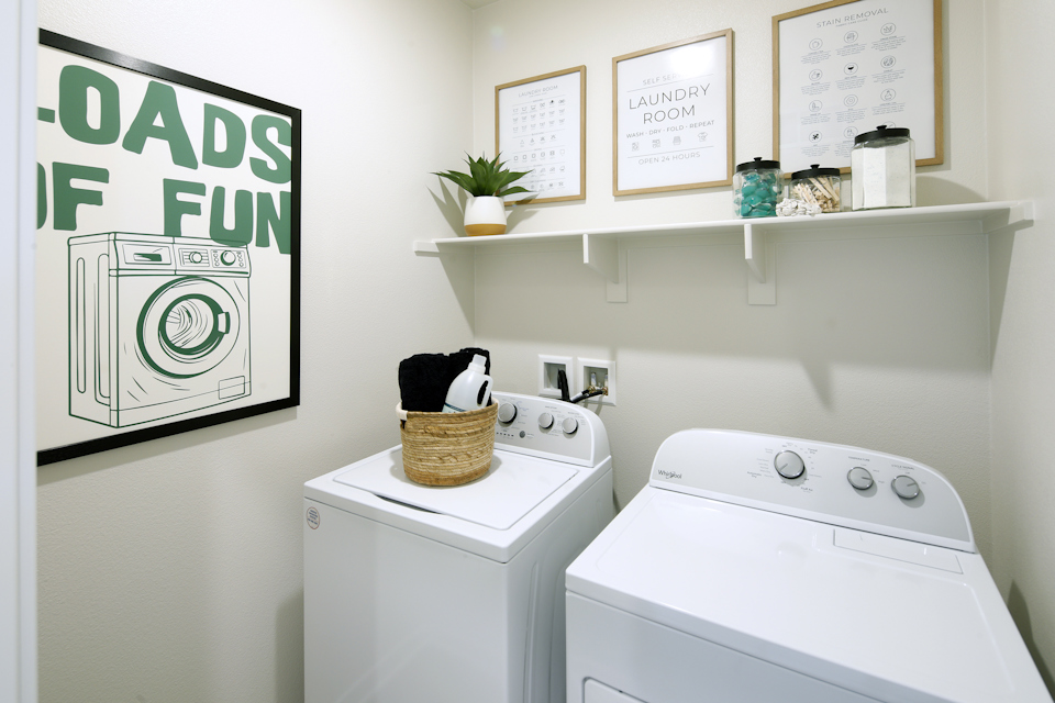 A laundry room with a washer and dryer.