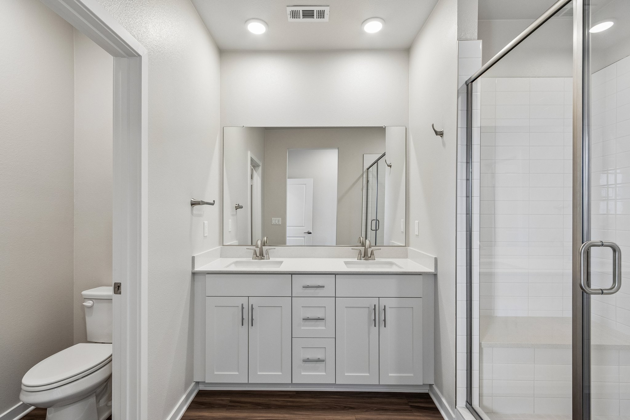A bathroom with a glass shower.
