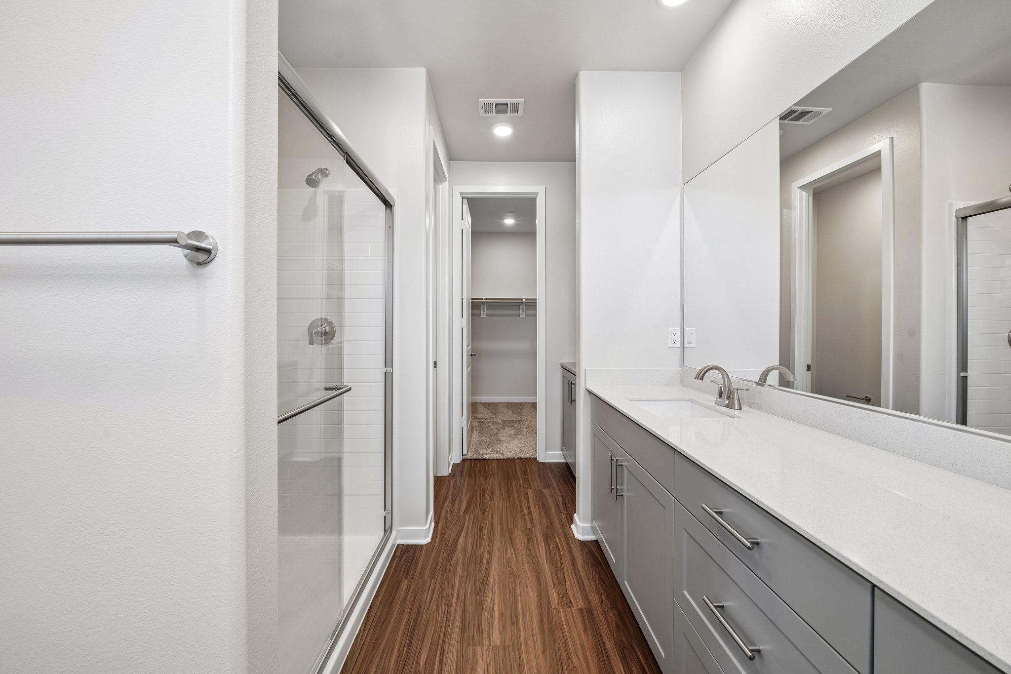 A bathroom with a glass shower.