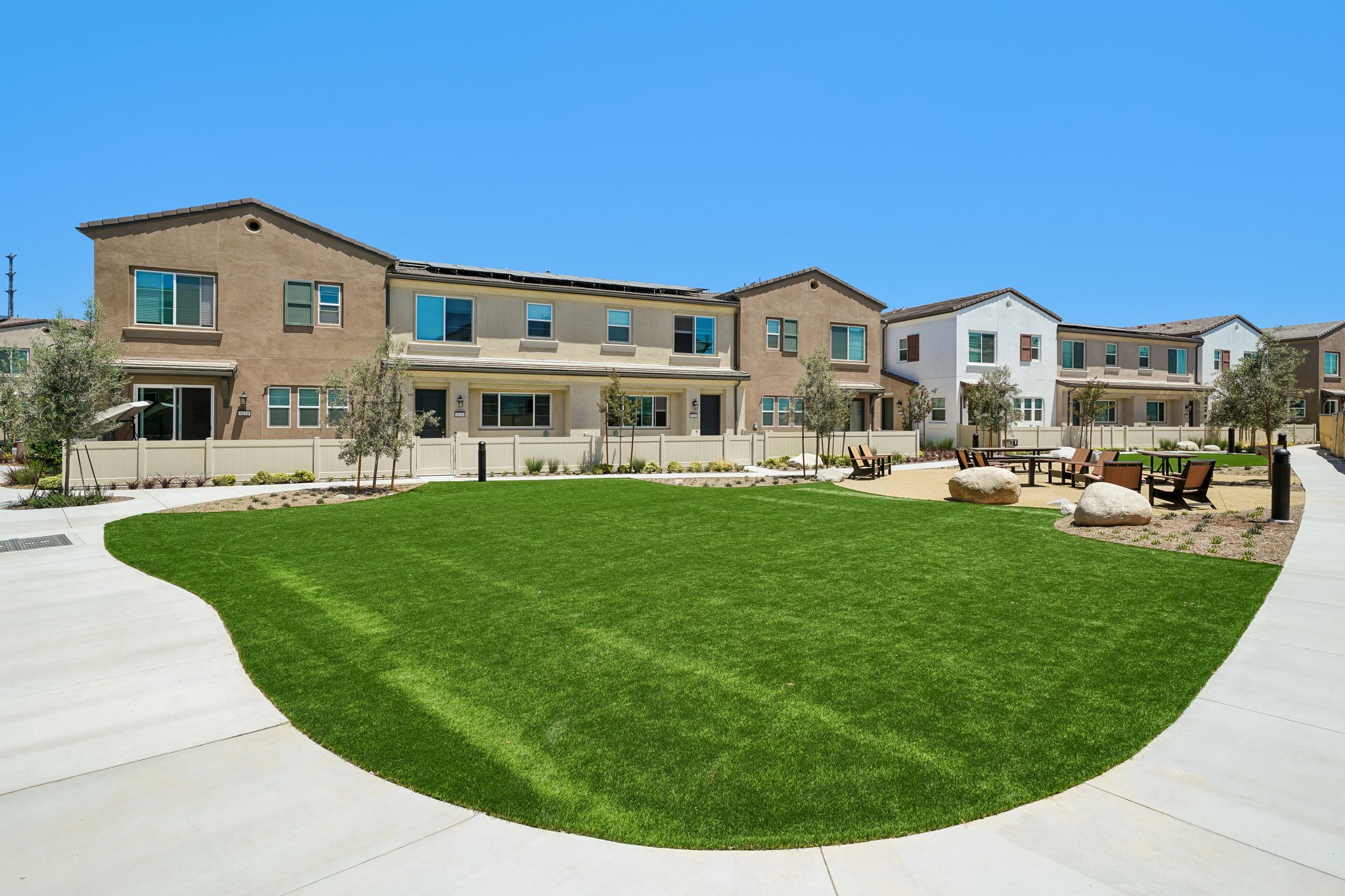 A large building with a lawn in front of it.