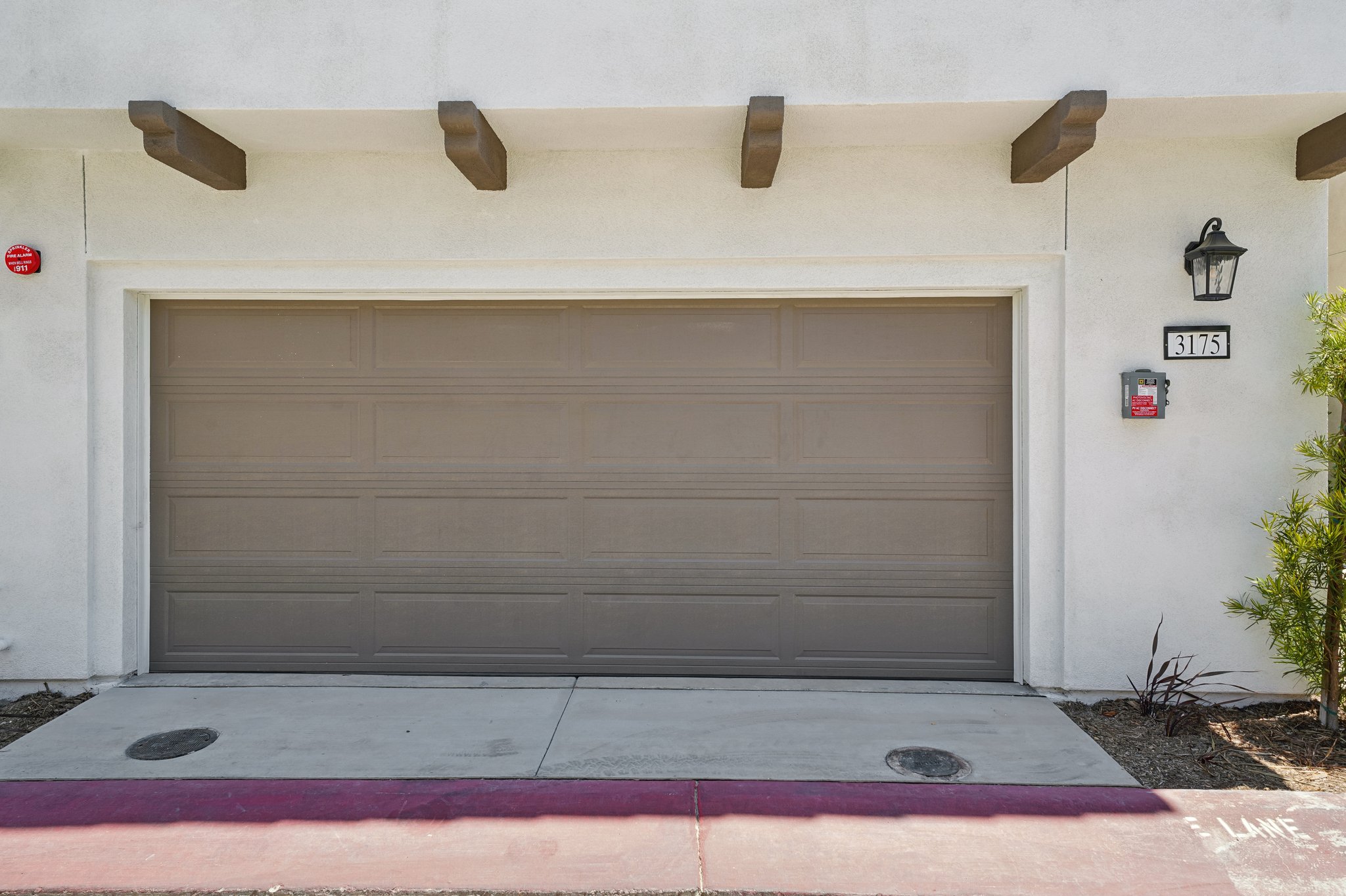 A garage door with a light on the roof.