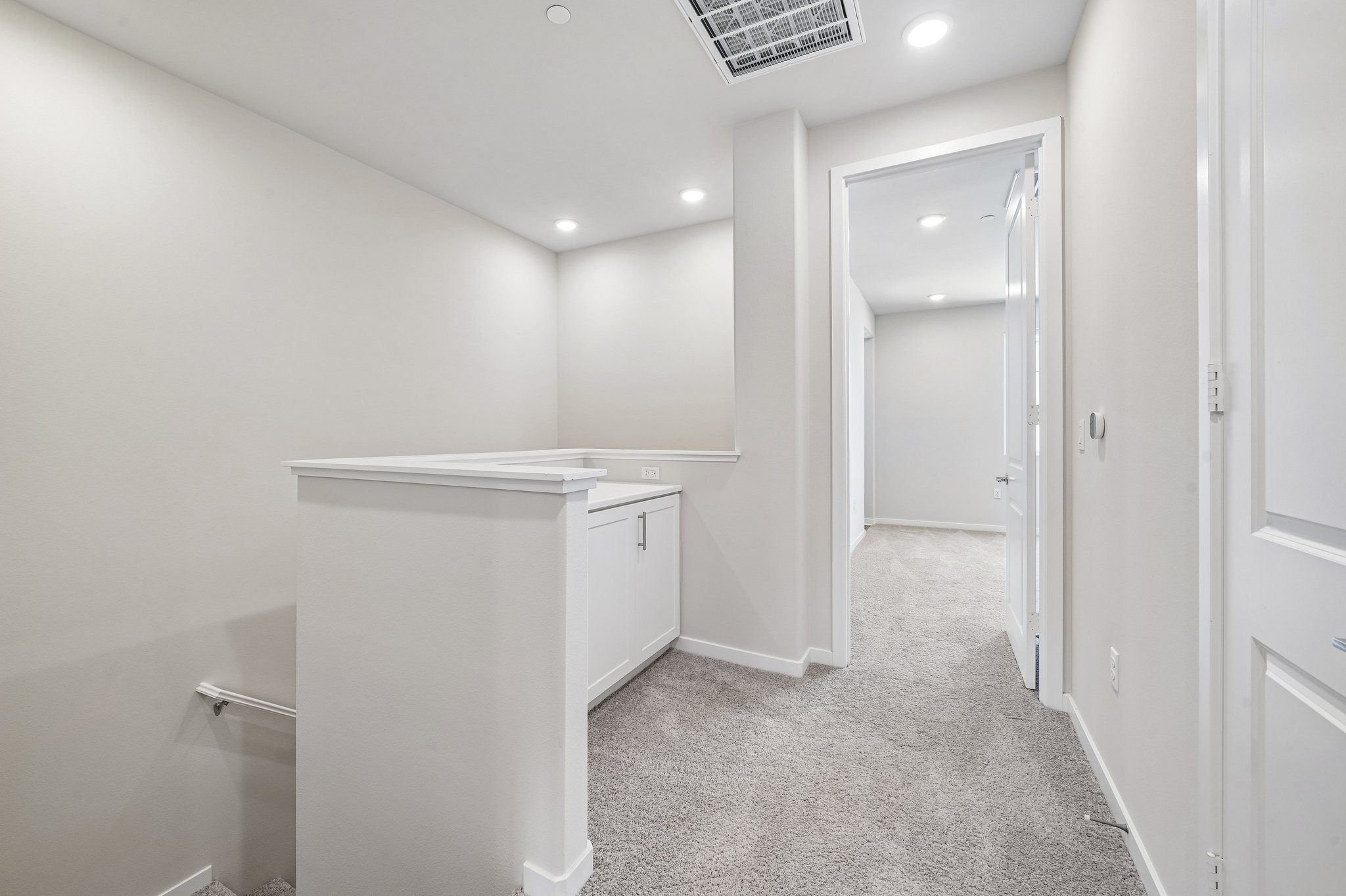 A room with white cabinets.