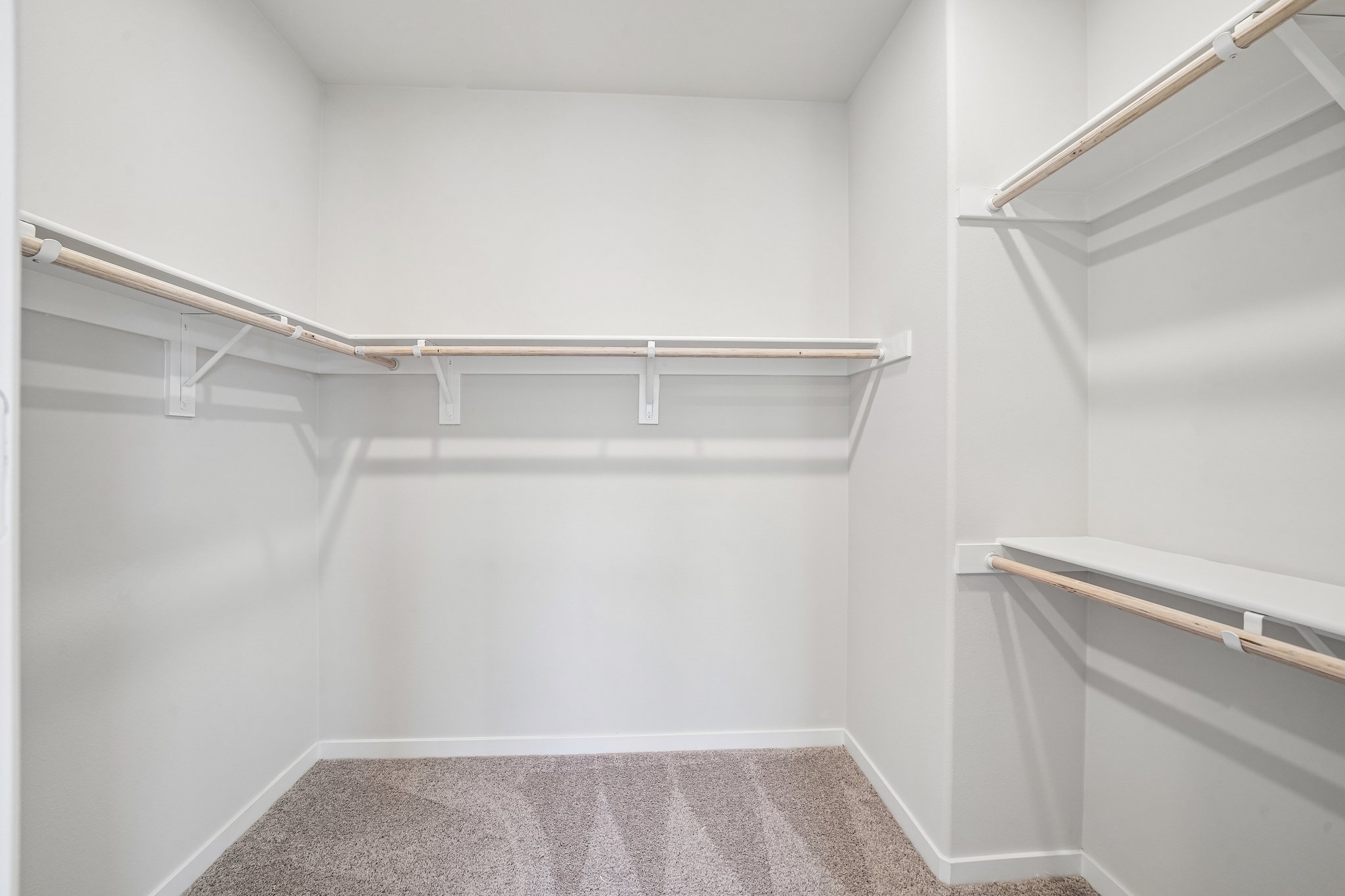 A white room with a metal railing.