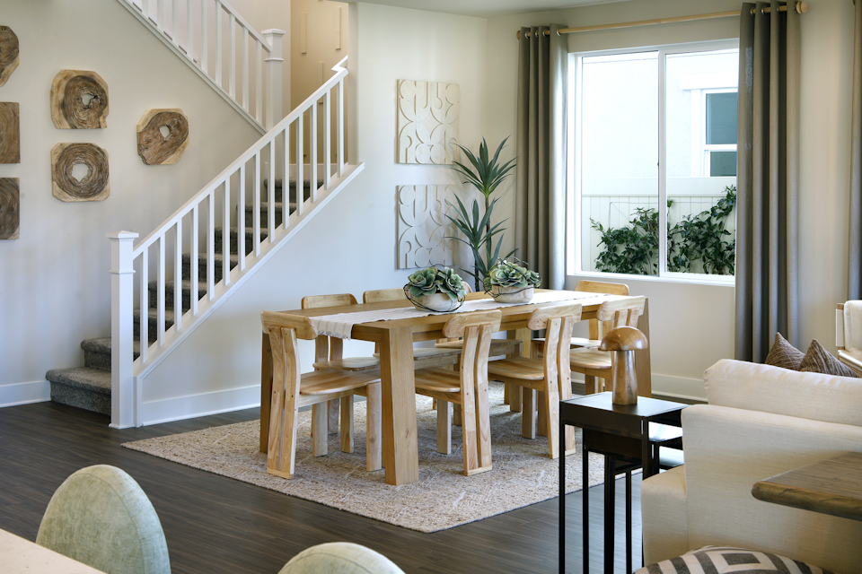 A living room with a staircase.