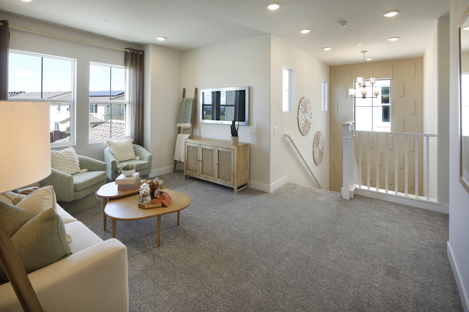 A living room with a tv and couches.