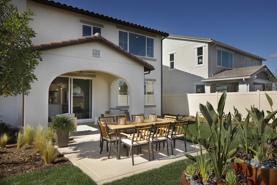 A patio with a table and chairs.