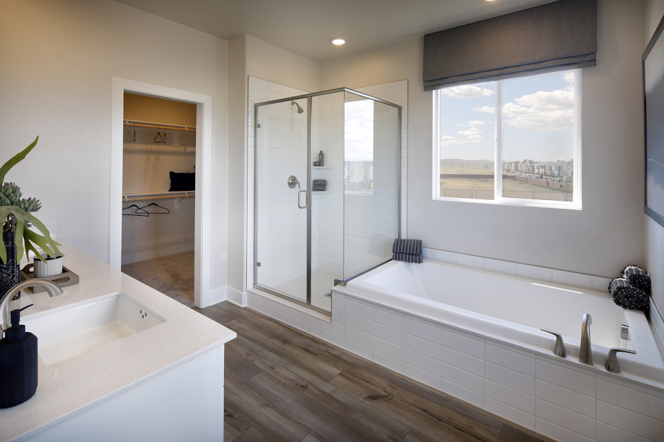 A bathroom with a tub and sink.