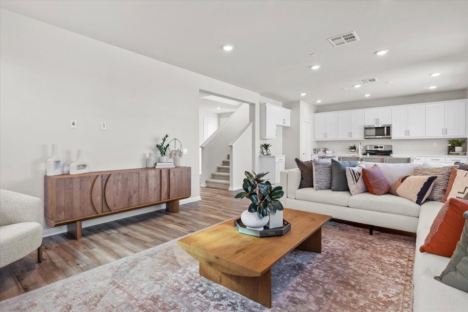 A living room with a couch and a table.