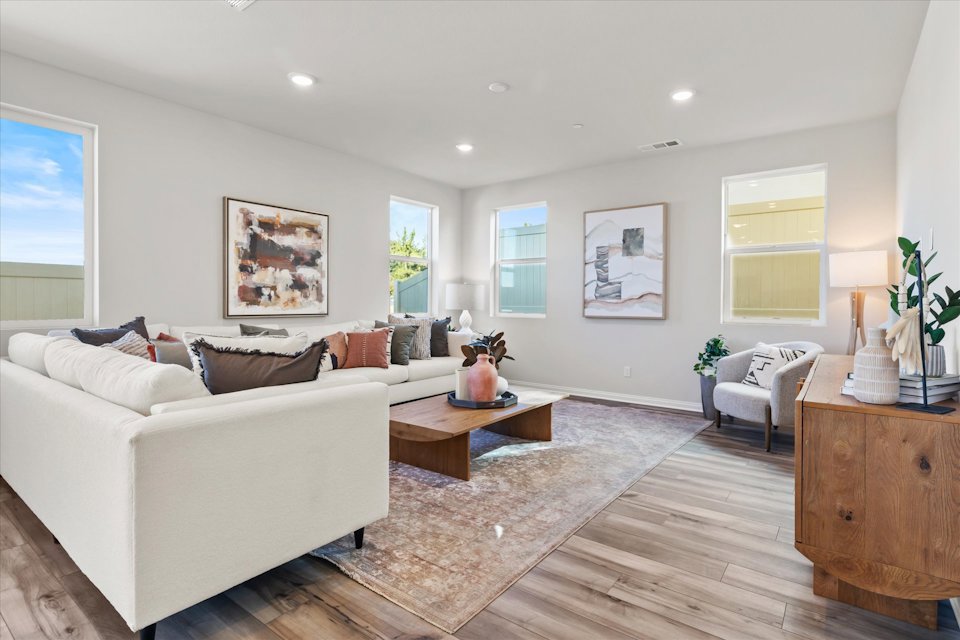 A living room with a white couch.