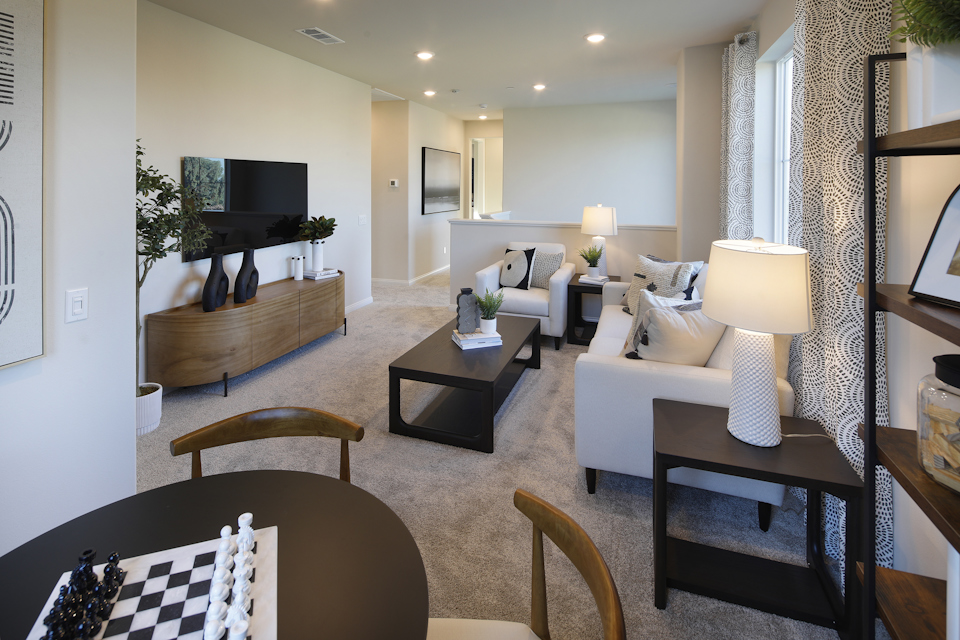 A living room with a large mirror.