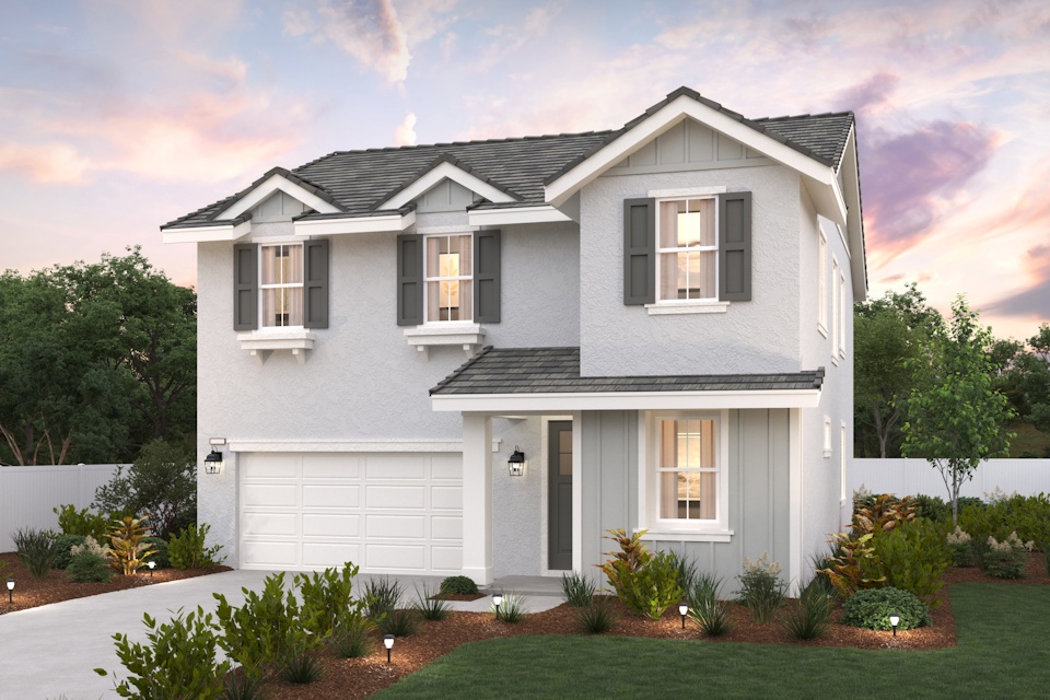 A white house with a garage with Graceland in the background.