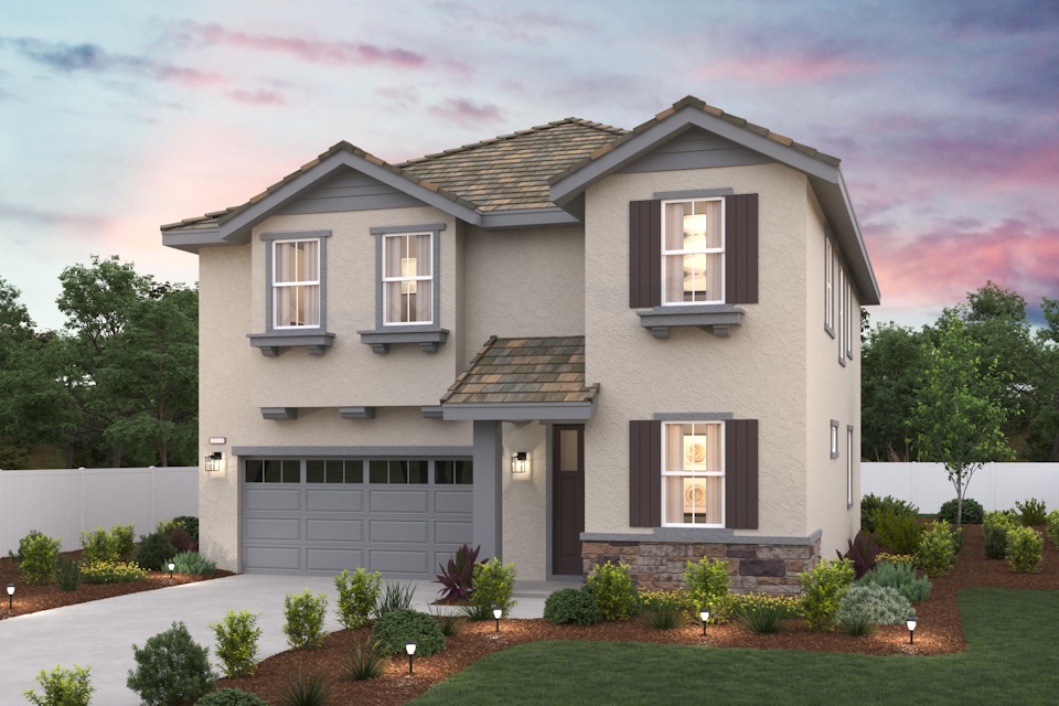 A house with a garage and a lawn in front of it.