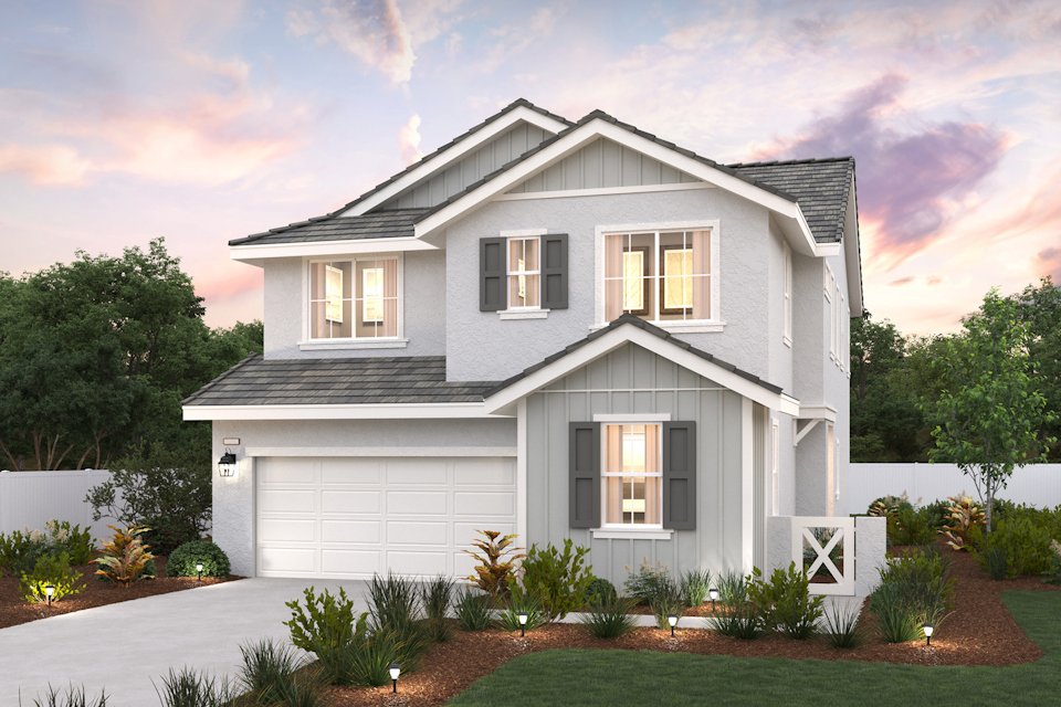 A white house with a driveway.