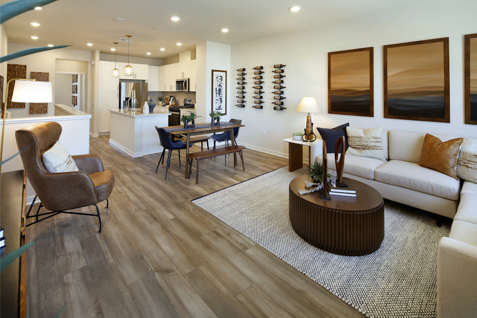 A living room with a wood floor.