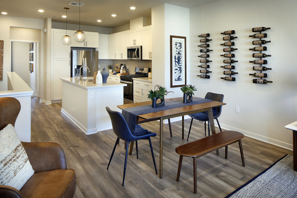 A kitchen with a dining table.