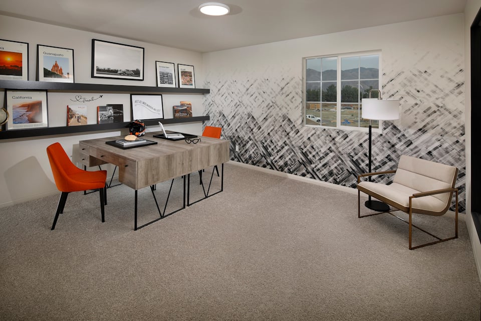 A room with a table and chairs.