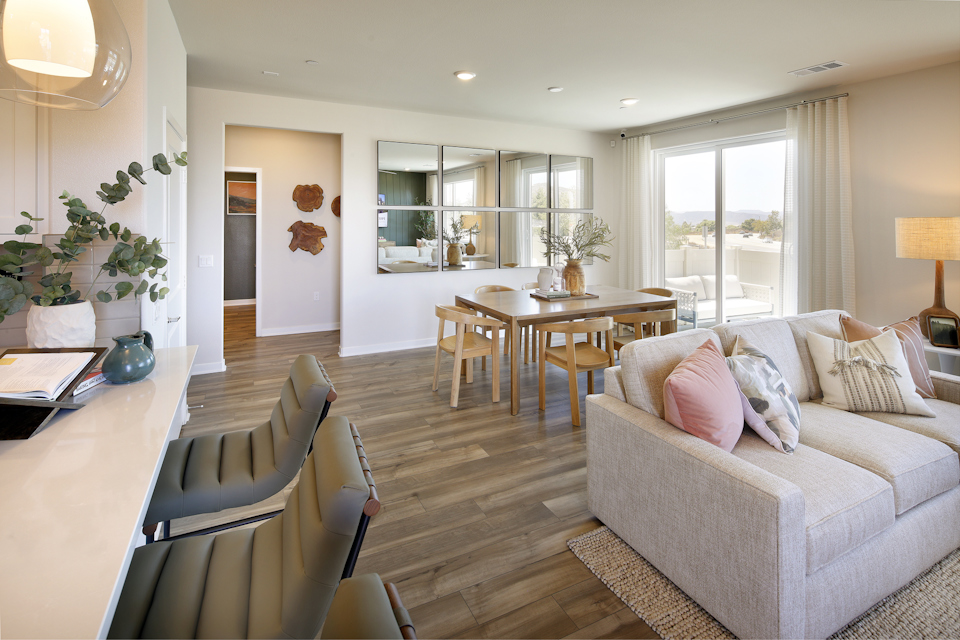 A living room with a wood floor.