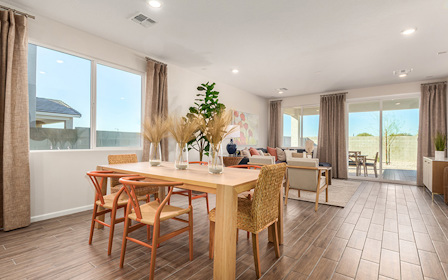 A room with a table and chairs.