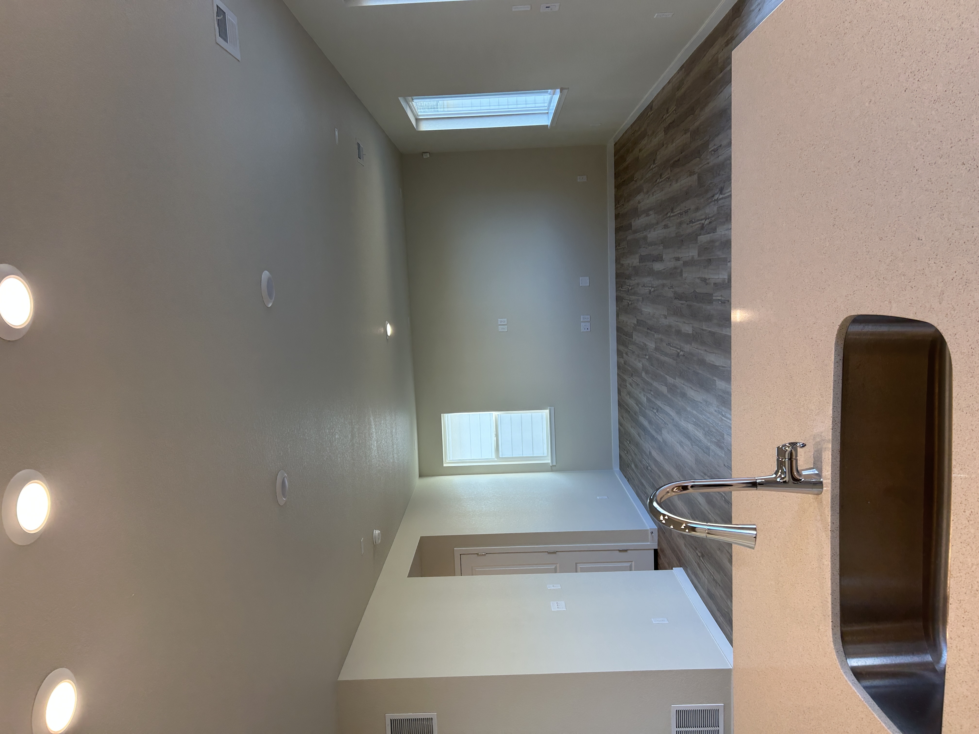 A kitchen with a sink and a countertop.