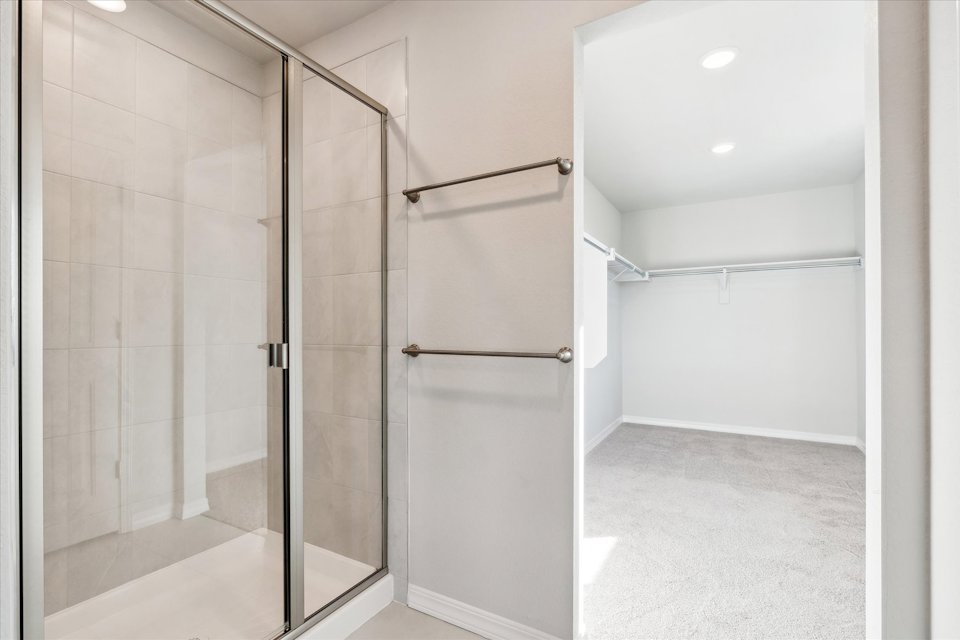 A shower with a glass door.
