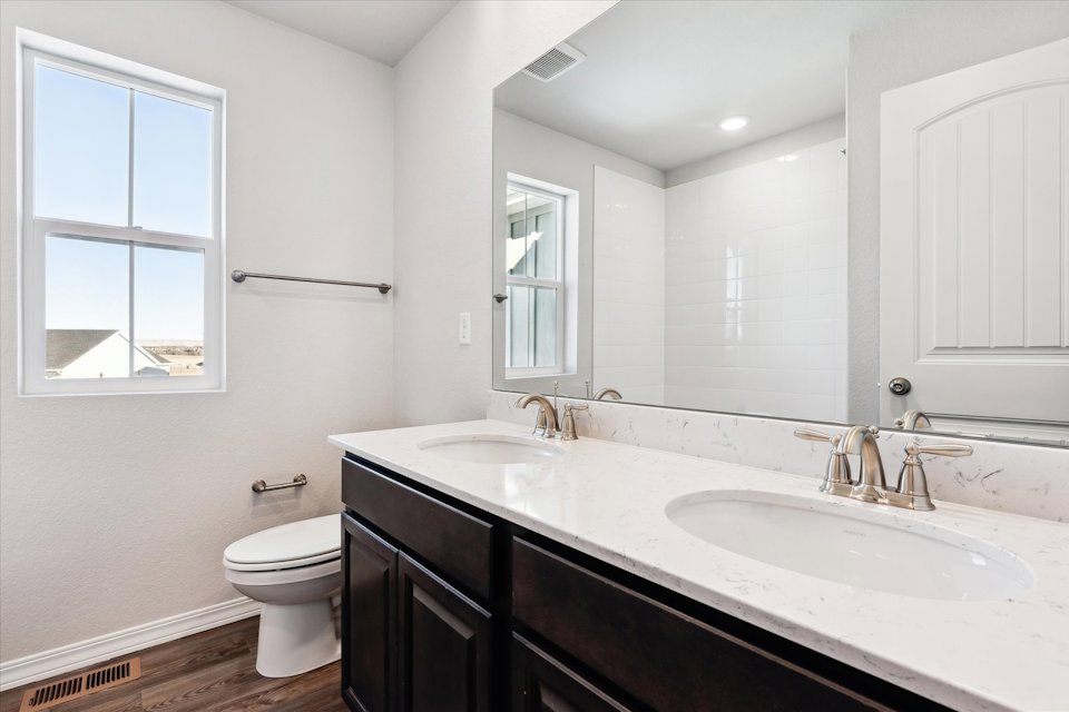 A bathroom with a sink and a toilet.