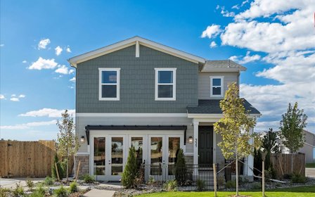 A house with a fence and trees.