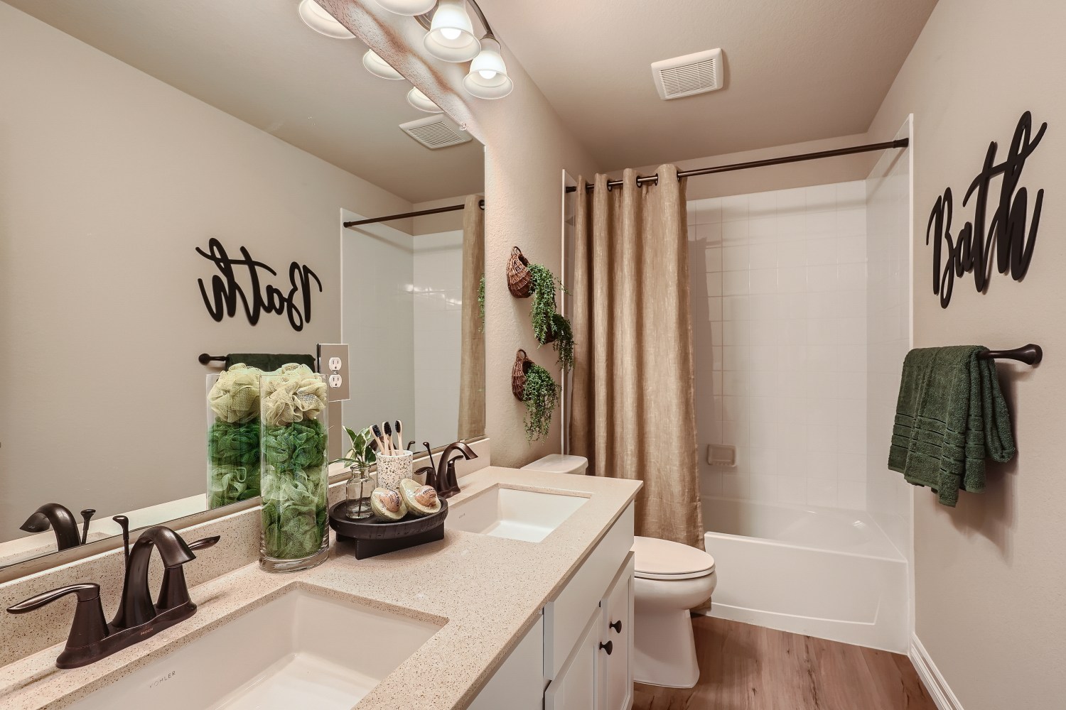 A bathroom with a sink toilet and bathtub.