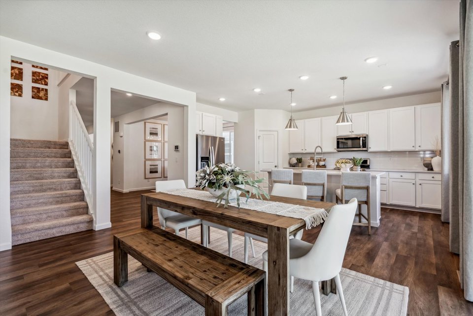 A kitchen with a dining table.