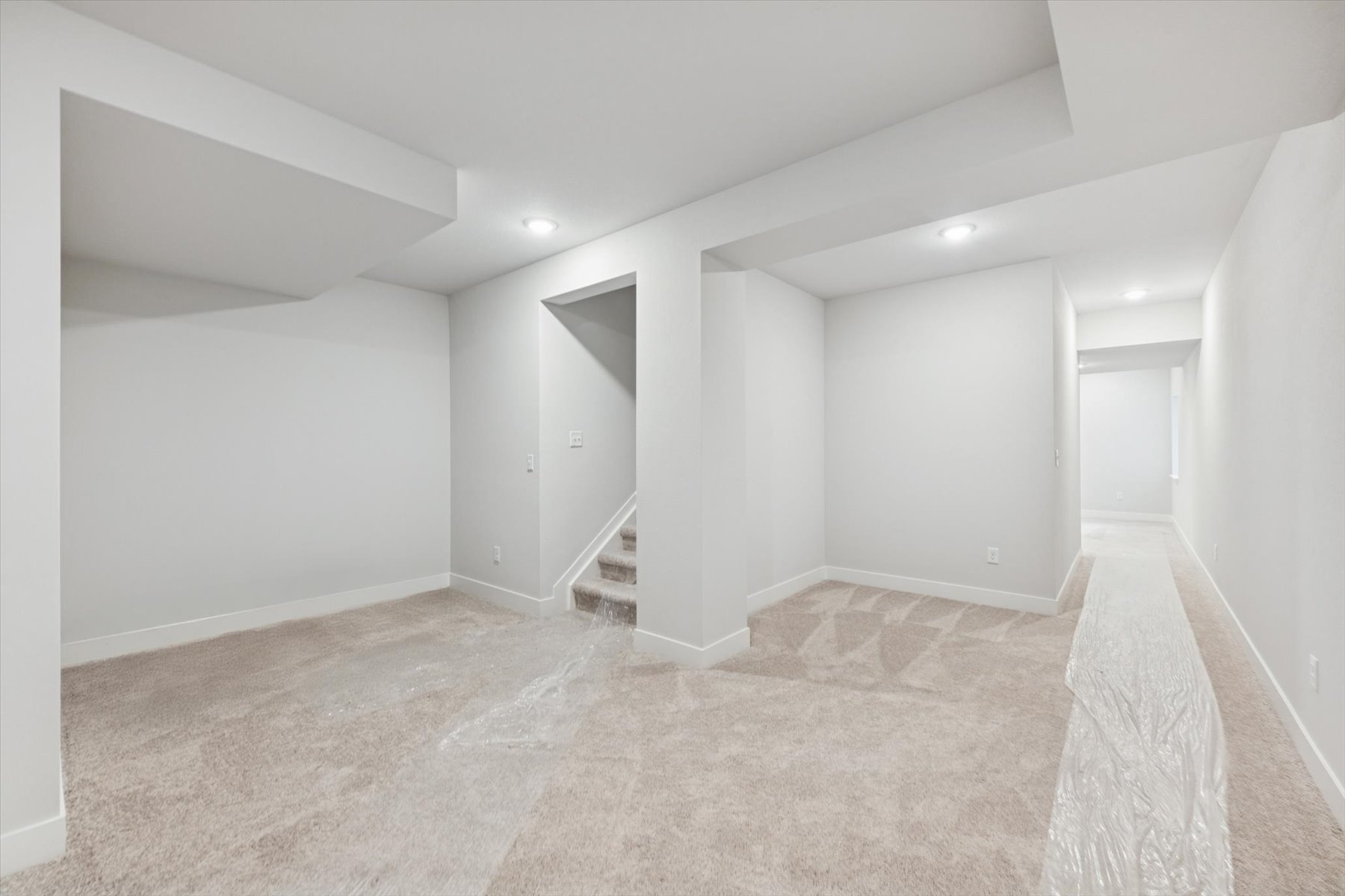 A hallway with white walls.