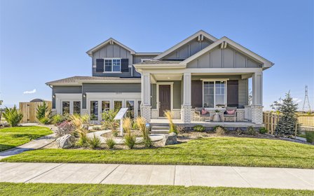 A house with a lawn and a walkway.