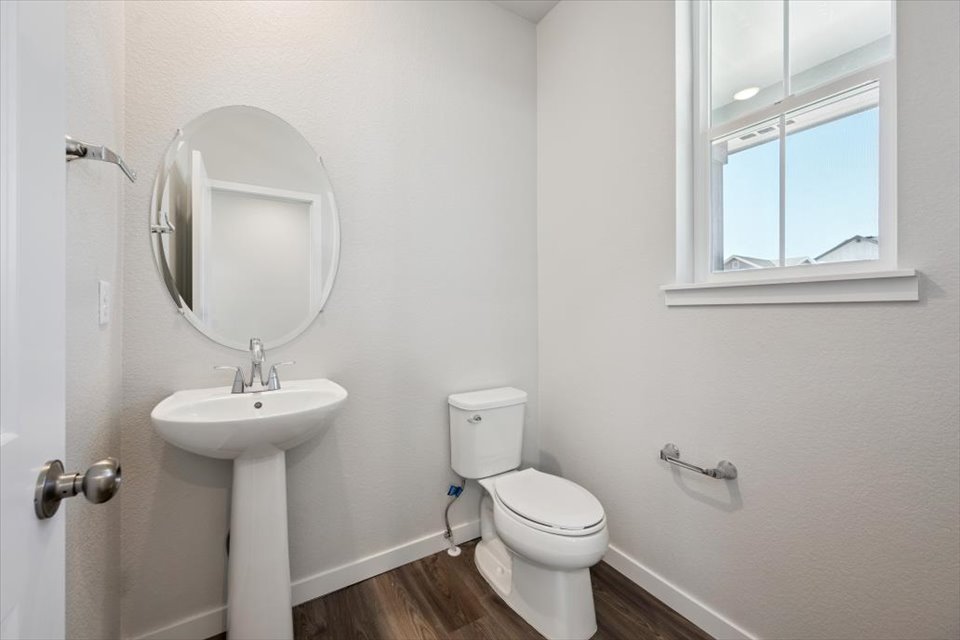 A bathroom with a toilet and sink.