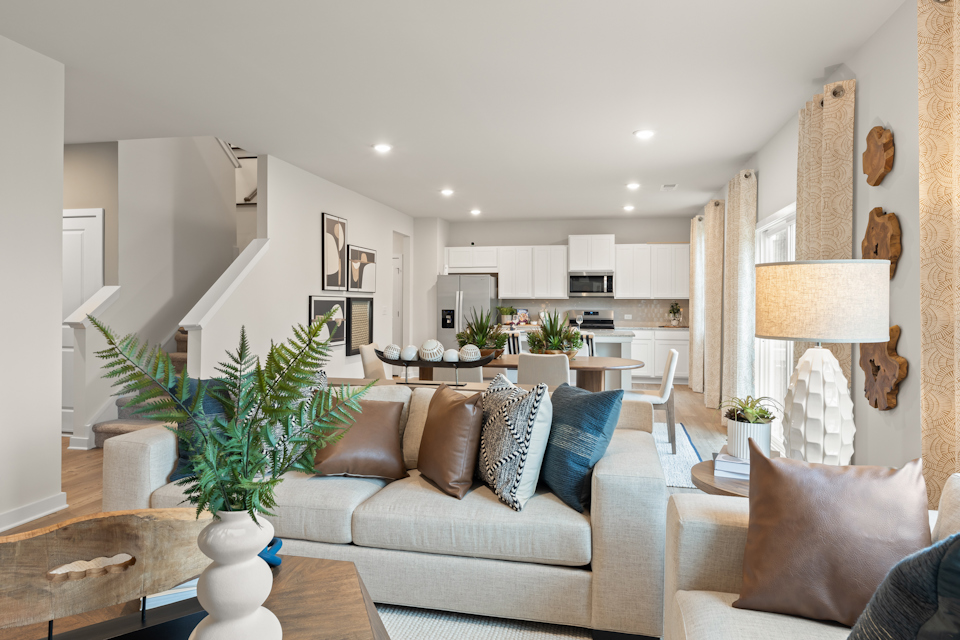 A living room with a couch and a table.