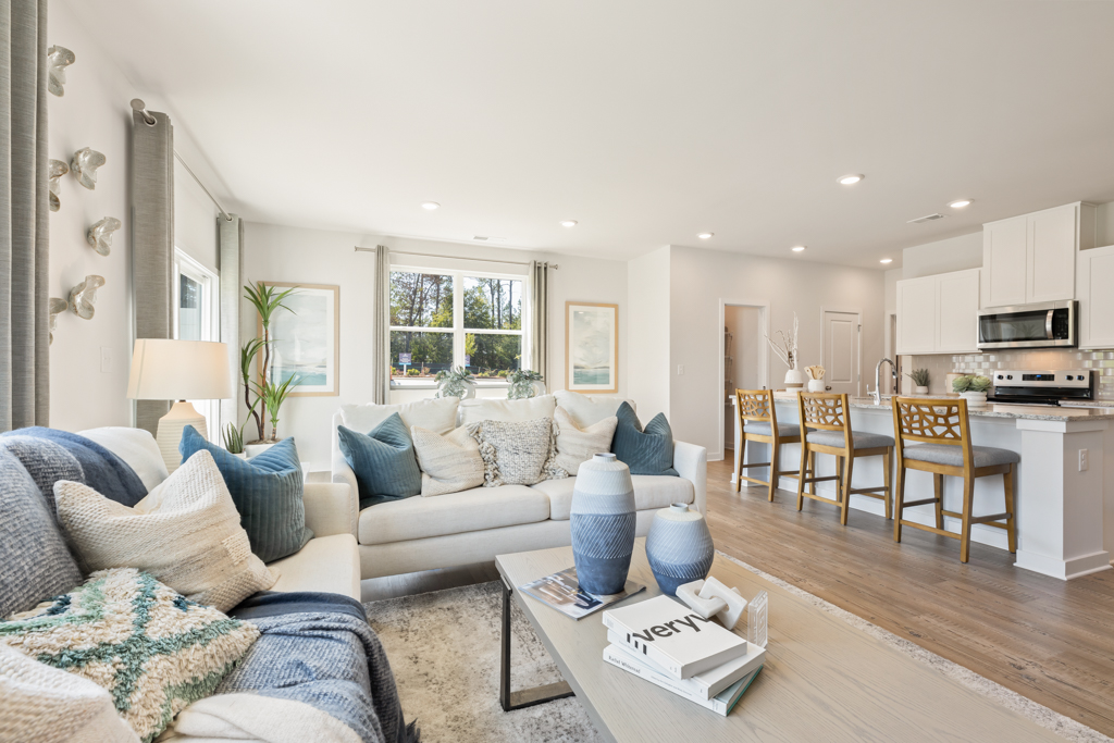 A living room with a wood floor.