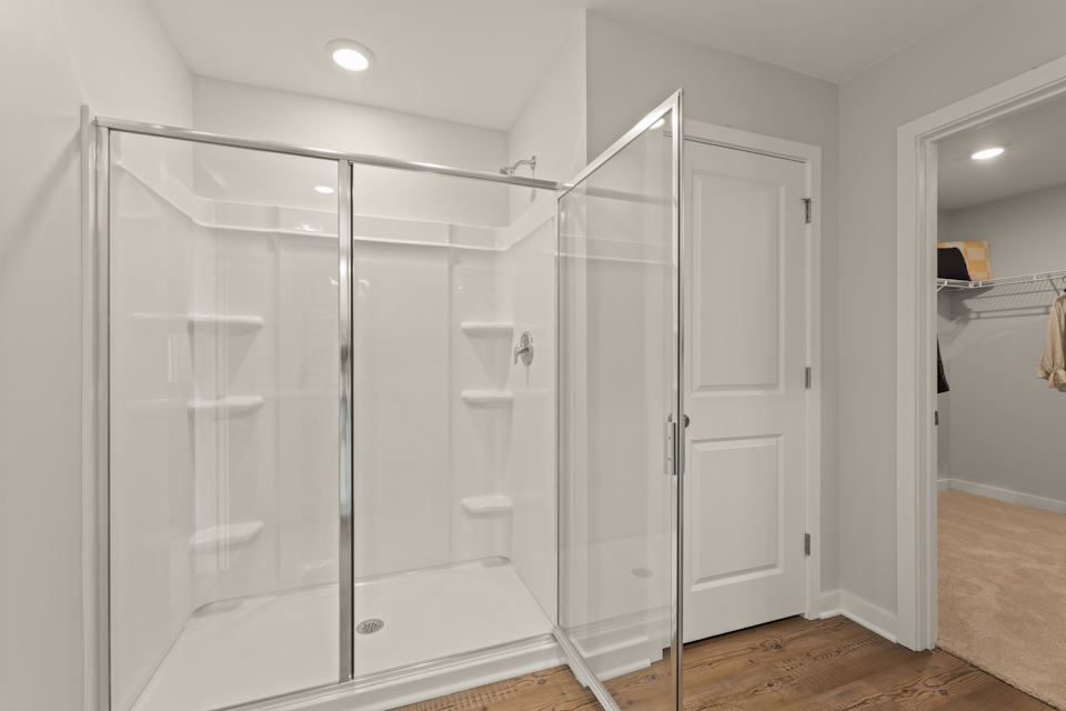 A bathroom with a glass shower.