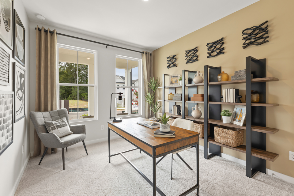 A room with a table and shelves.
