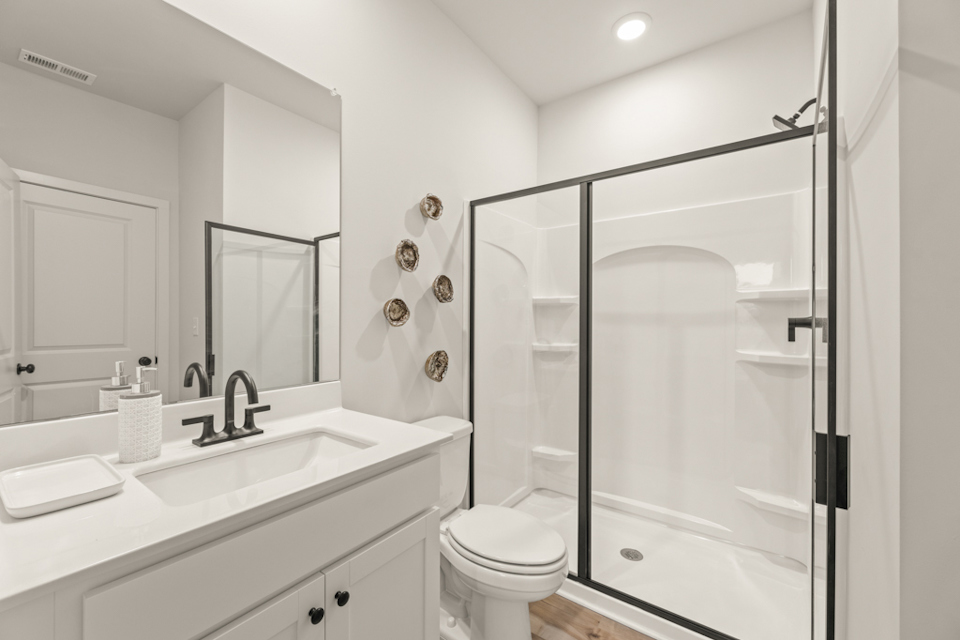 A bathroom with a glass shower.