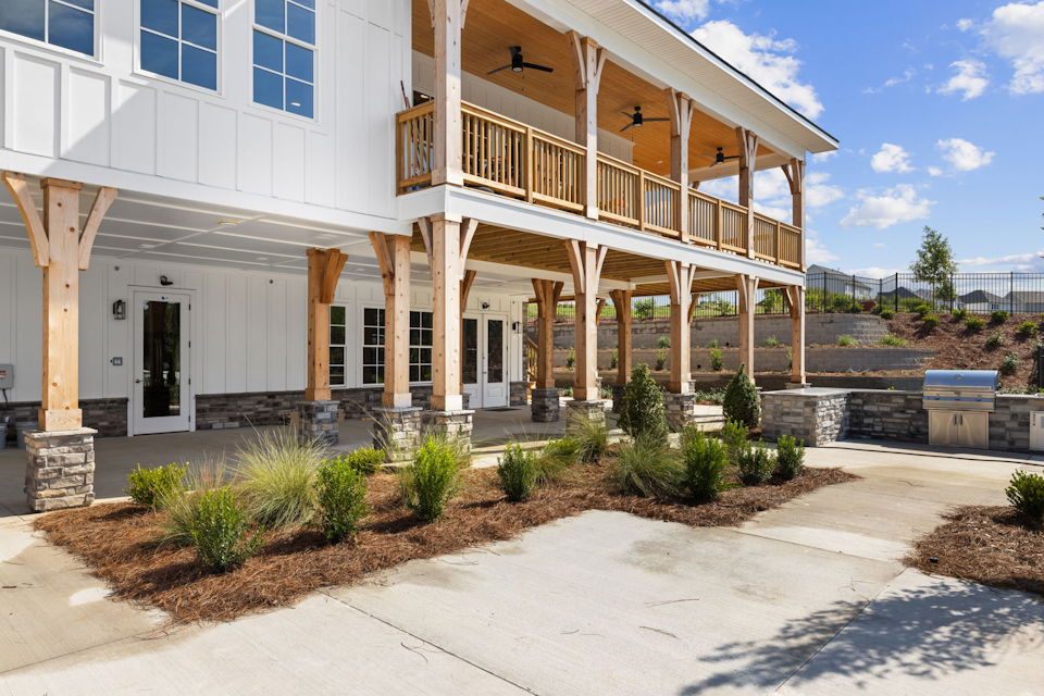 A white building with a walkway.