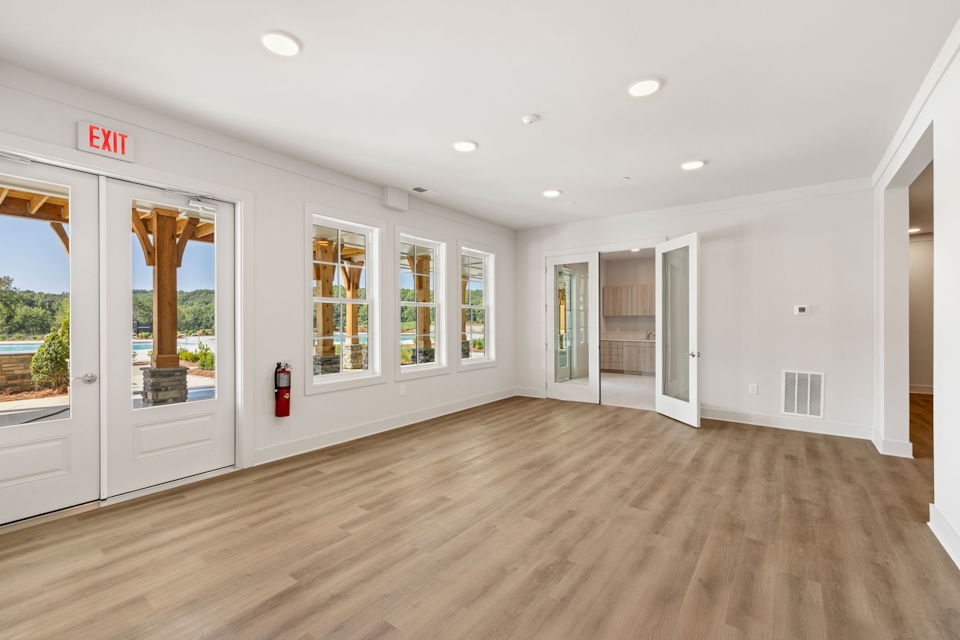 A room with white walls and a wood floor.
