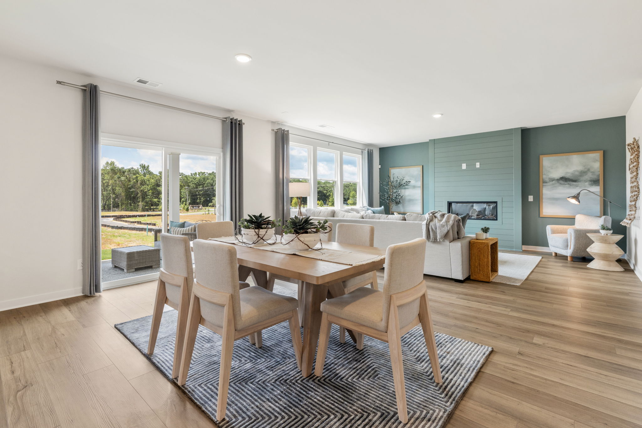 A dining room with a large table.