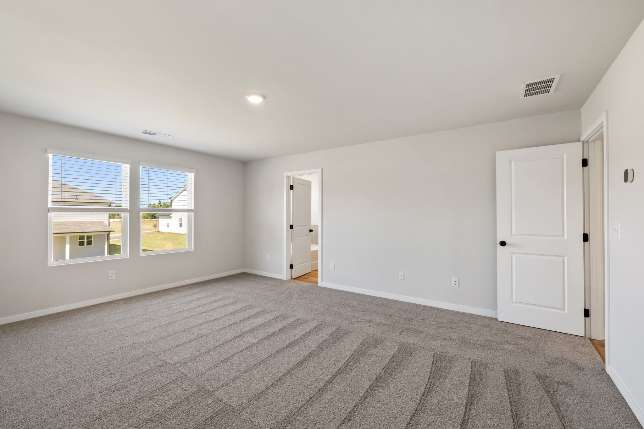 A room with white doors and windows.