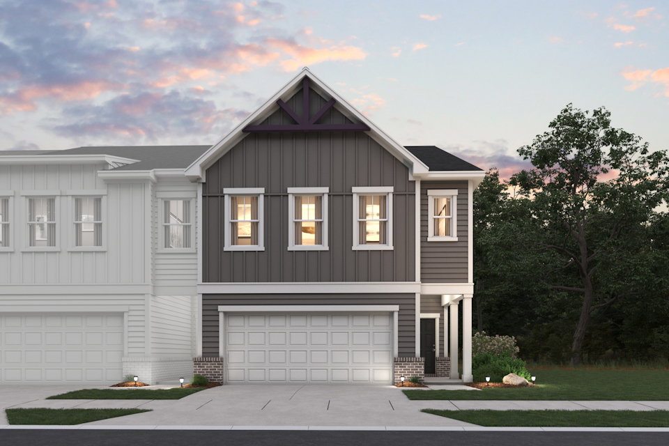 A grey house with a garage.