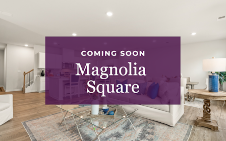 A room with a couch and a table with a lamp and a wall with a purple wall with.