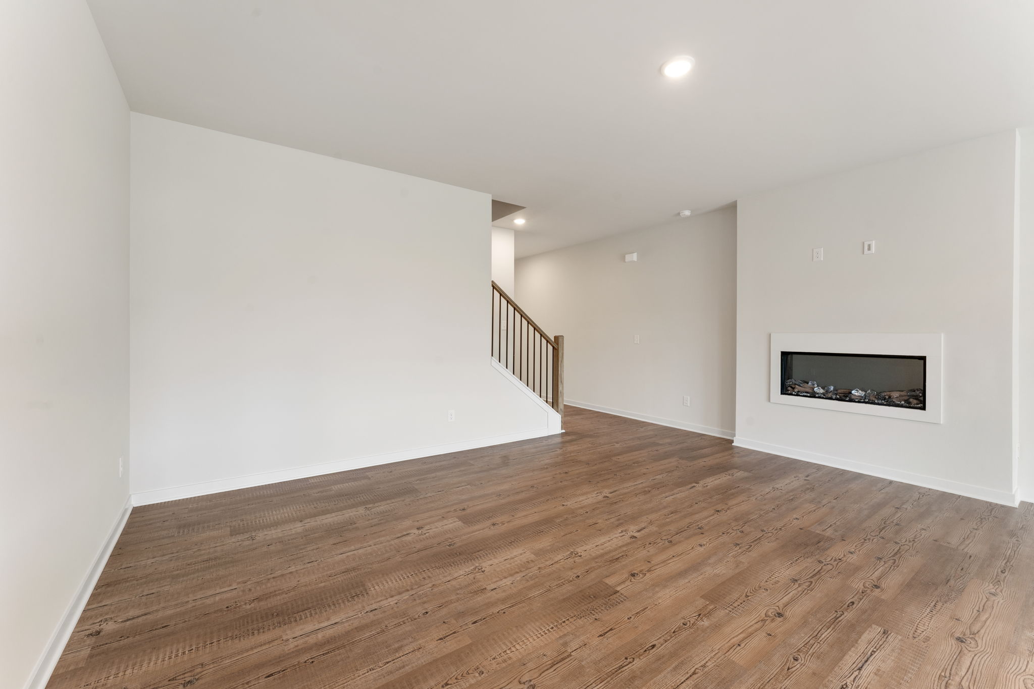 A room with a wood floor and a wood floor.